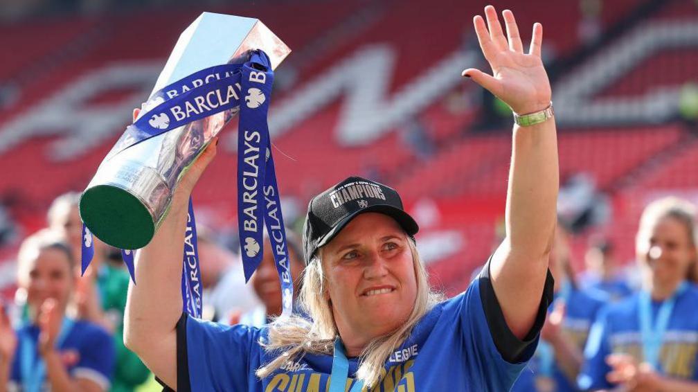 Emma Hayes holds the trophy after winning the 2023/4 Women's super league 