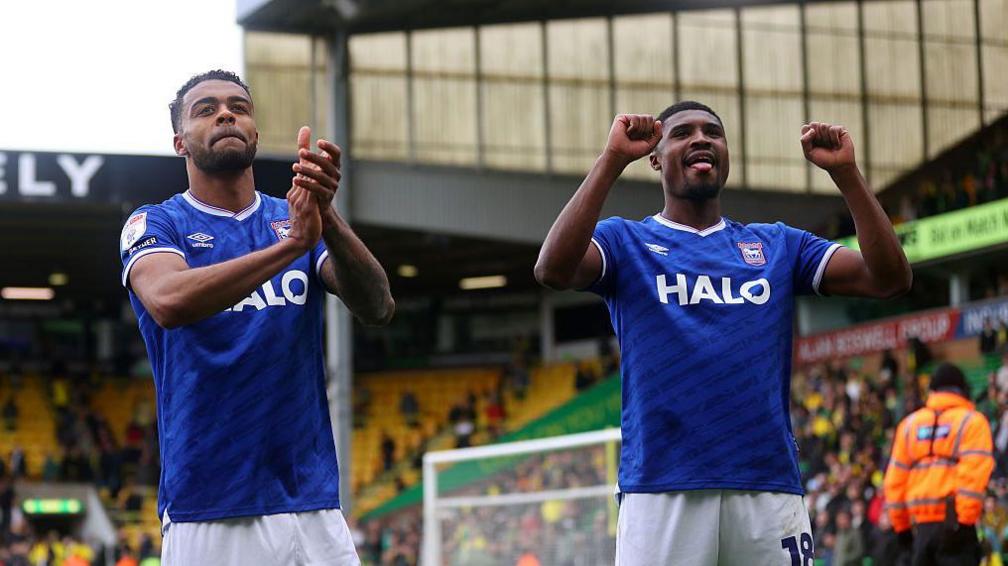 Darnell Furlong and Ben Johnson of Ipswich Town celebrates after the teams victory following the Sky Bet Championship match between Norwich City and Ipswich Town