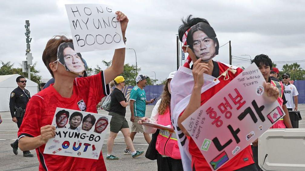 People protesting head coach of South Korea outside the stadium before World Cup round of 32 knock out match between Canada and South Africa at SoFi Stadium on Sunday, June 28, 2026 in Inglewood, CA. 