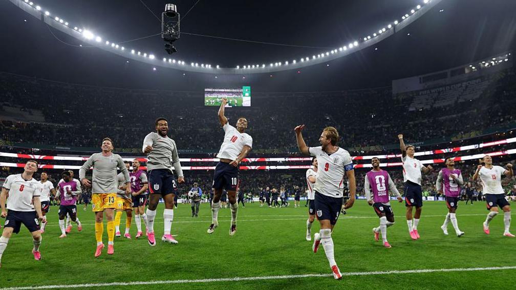 England celebrate victory and going through the quarter finals of the World Cup.