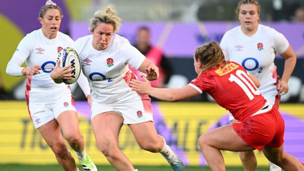 Marlie Packer moving  with the shot  against Canada