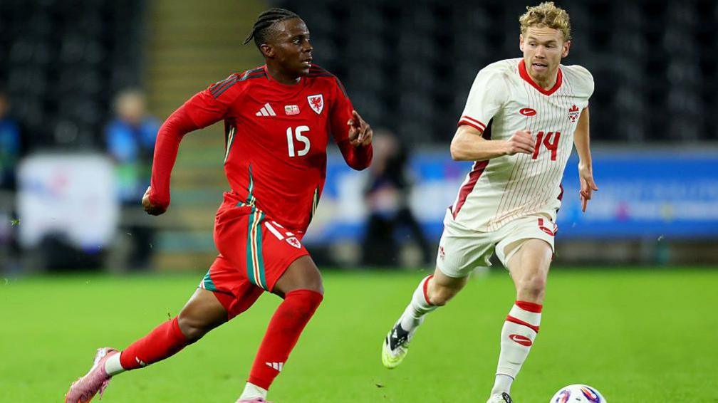 Ronan Kpakio (left) in action for Wales against Canada
