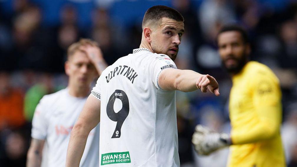 Zan Vipotnik points during a game