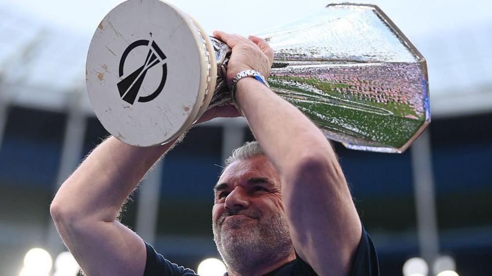 Ange Postecoglou lifts Europa League trophy