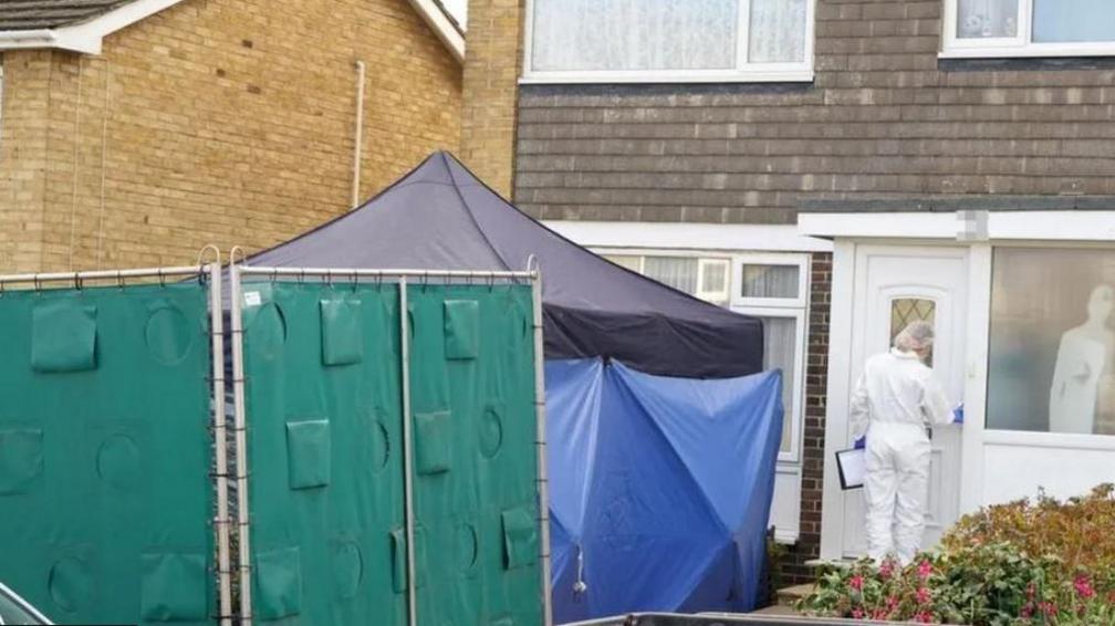 A police cordon outside a property in Northbourne Close, Shoreham