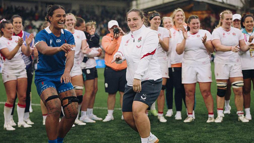 England and Samoa players dance