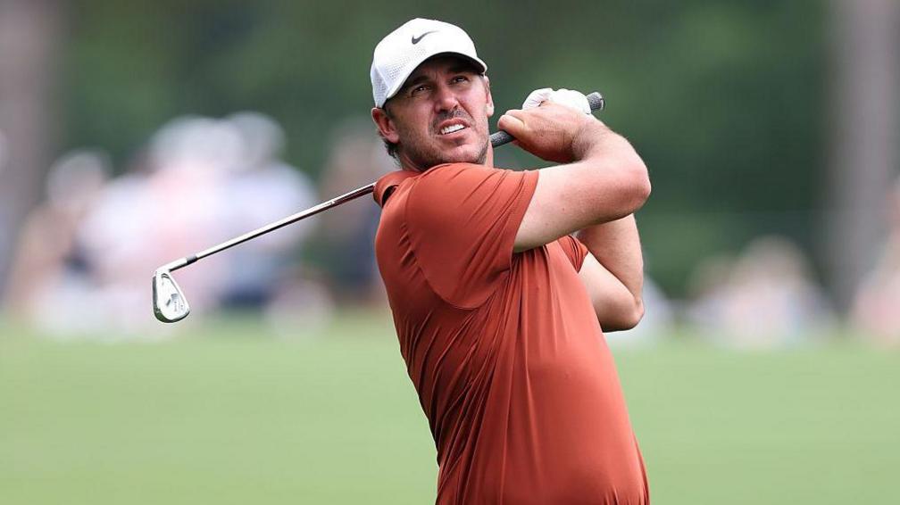 Brooks Koepka looks on