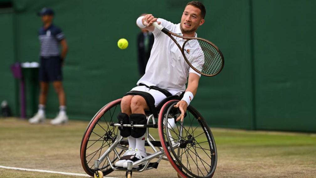 Alfie Hewett hitting tennis ball