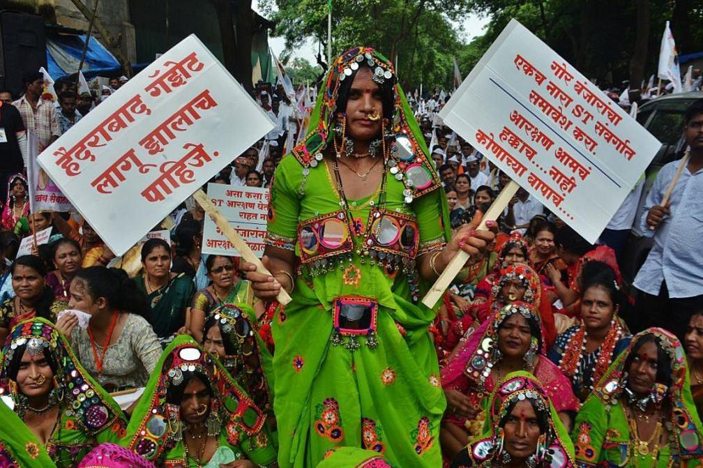 Members of the Banjara community from across Maharashtra gathered in Thane on Saturday to press their key demands implementation of the Hyderabad Gazette and inclusion of the community in the Scheduled Tribes (ST) category to secure reservation benefits, on October 4, 2025 in Mumbai, India. Thousands of community members participated in the morcha, raising slogans as they marched through major roads of the city before reaching the District Collector's office. The protesters urged the government to take an immediate and positive decision to ensure justice for the Banjara community. (Photo by Praful Gangurde/Hindustan Times via Getty Images)
