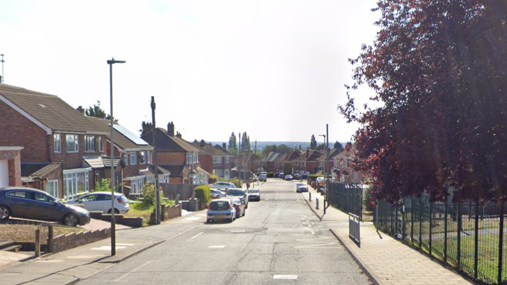 Avebury Avenue, with a school on one side of the road