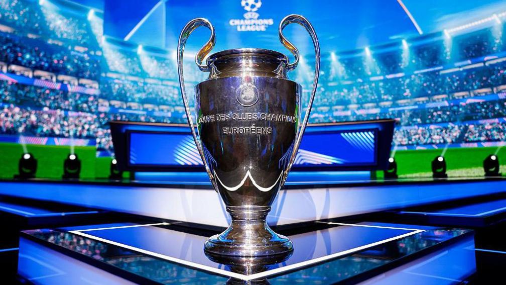 The UEFA Champions League trophy is seen on the stage ahead of the League Phase draw 