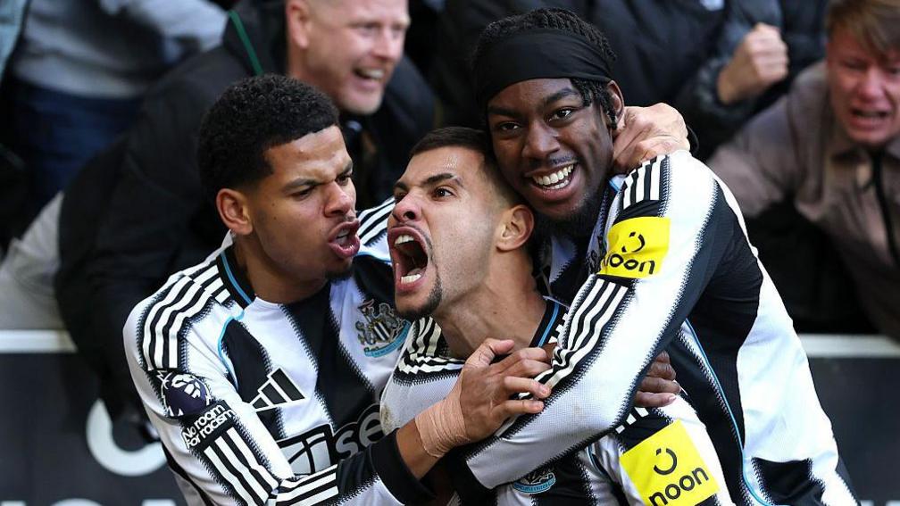 Bruno Guimaraes celebrates with William Osula and Anthony Elanga after scoring for Newcastle