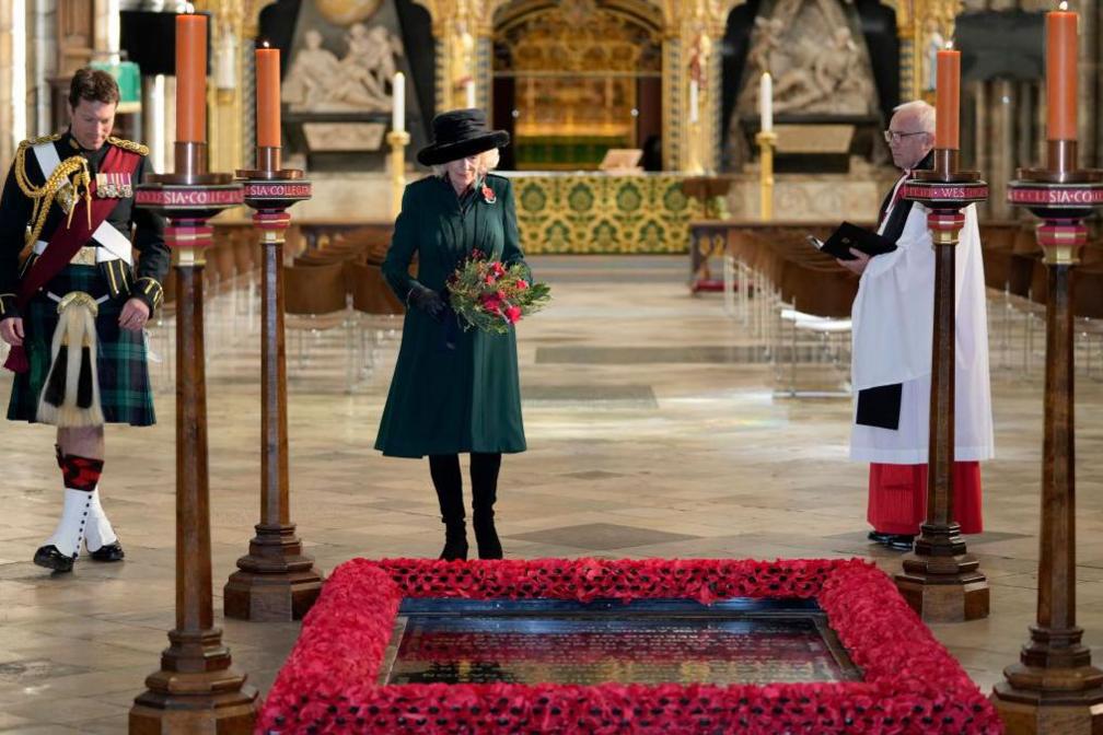 Camilla, then Duchess of Cornwall, lays flowers as she visits the Grave of the Unknown Warrior at Westminster Abbey on 11 November 2021 