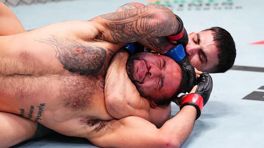 Yadier del Valle of Cuba secures a rear choke submission against Isaac Dulgarian at UFC Vegas 110
