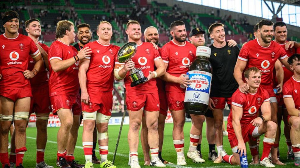 Wales captain Dewi Lake lifts the trophy