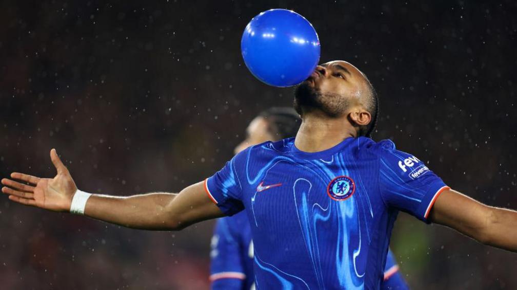 Christopher Nkunku celebrates by blowing up a balloon and putting it in his mouth after scoring against Southampton. 