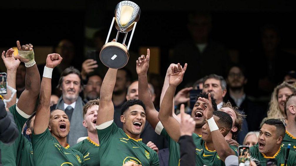 Sacha Feinberg-Mngomezulu lifts the Rugby Championship trophy