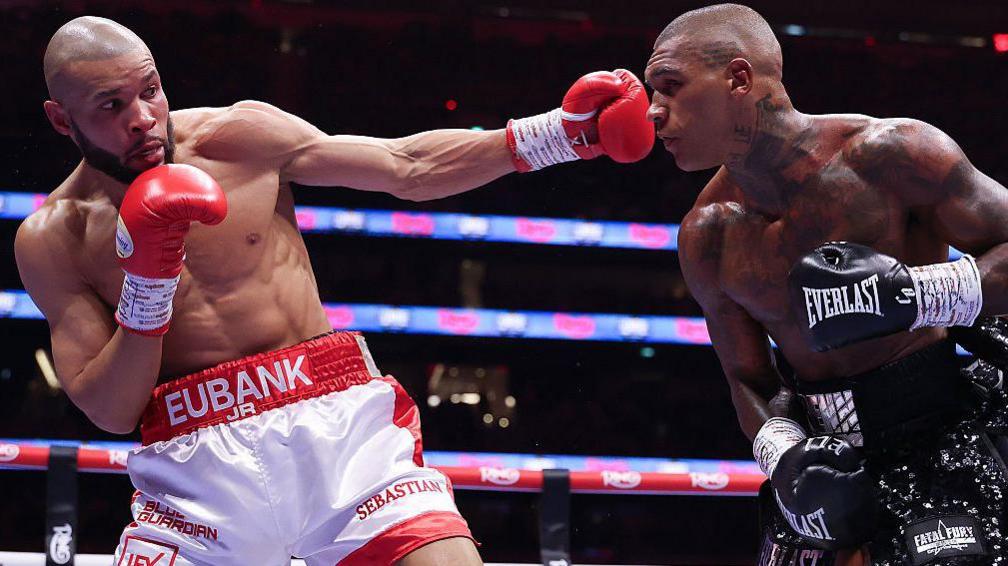 Chris Eubank Jr throws a left hook at Conor Benn