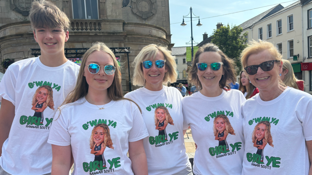 Five people wearing t-shirts that say "G'wan ya girl ye. Hannan Scott" 