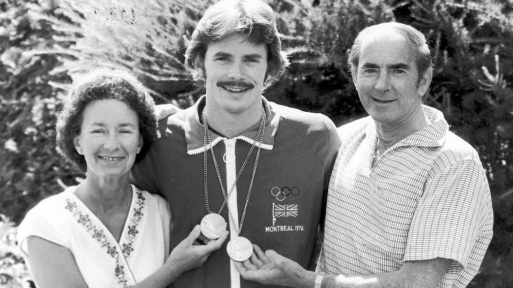 David Wilkie (centre) with his parents