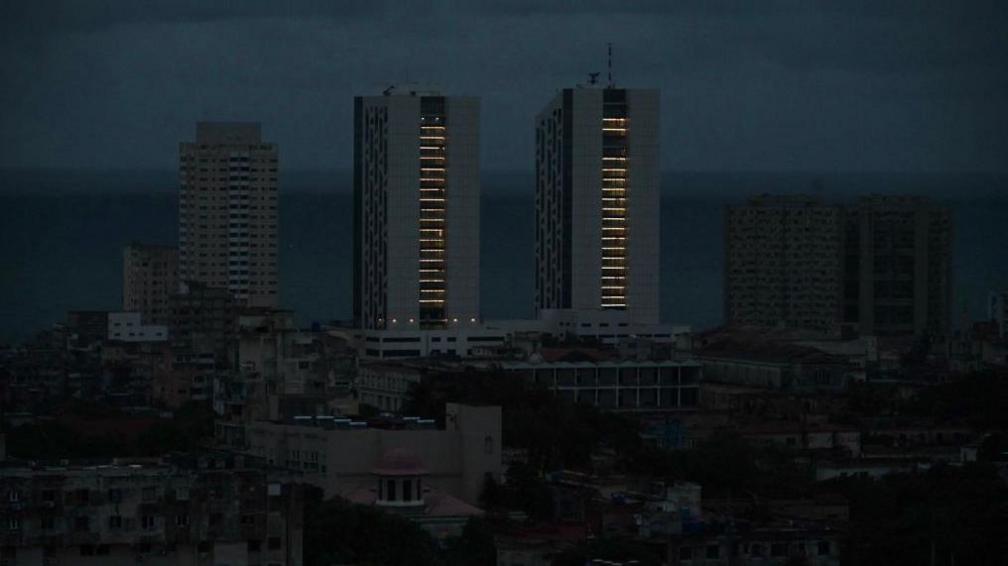 A few buildings in the city with electricity are seen during a nationwide blackout caused by a grid failure in Havana on October 18, 2024