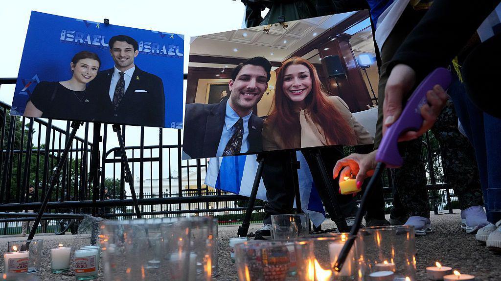 Photos memorializing two Israeli Embassy staff members, Yaron Lischinsky and Sarah Lynn Milgrim, who were shot and killed