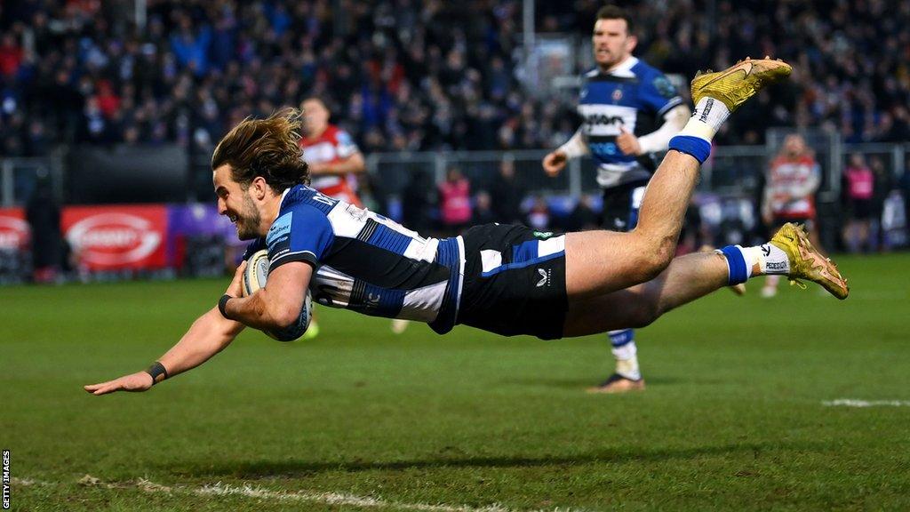 Tom de Glanville dives over the try line to score during Bath's game with Gloucester