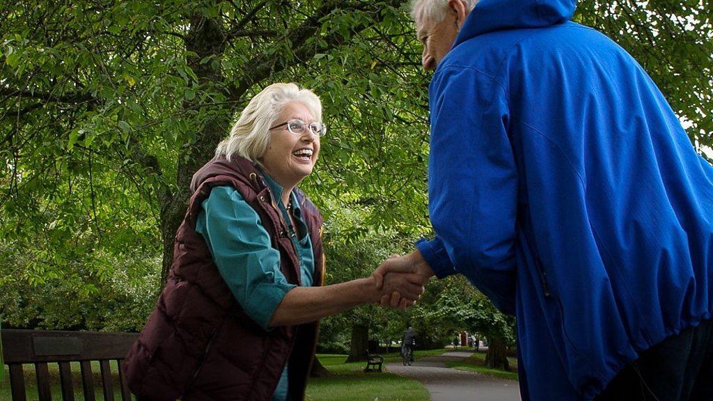 woman and man shaking hands