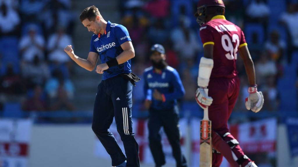 Chris Woakes of England celebrates dismissing Kraigg Brathwaite of