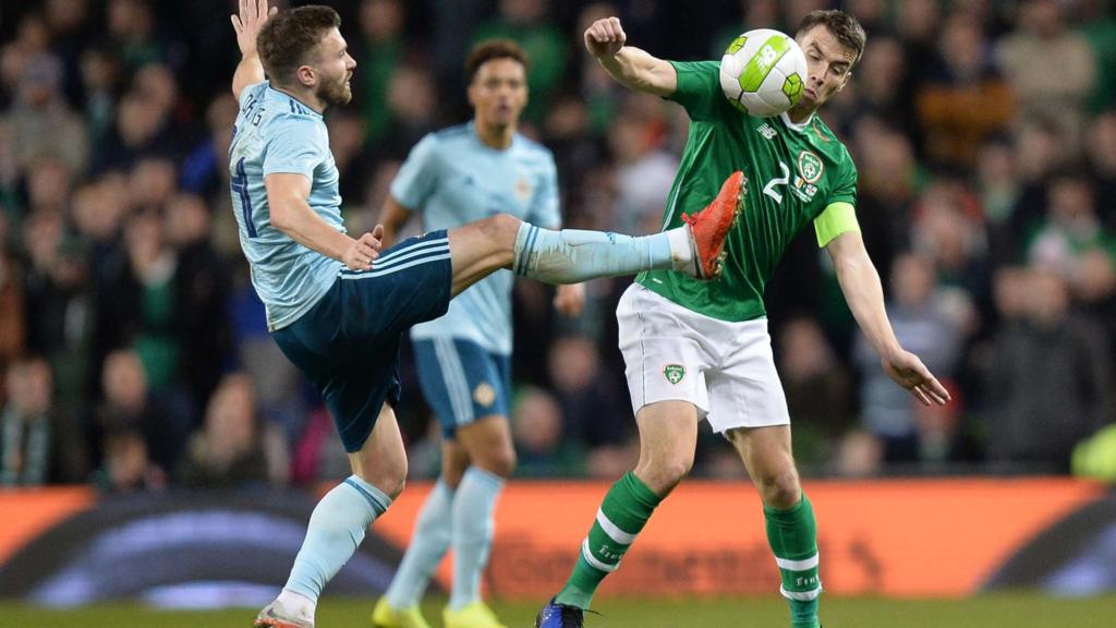 Northern Ireland's Stuart Dallas competes against Seamus Coleman of the Republic of Ireland