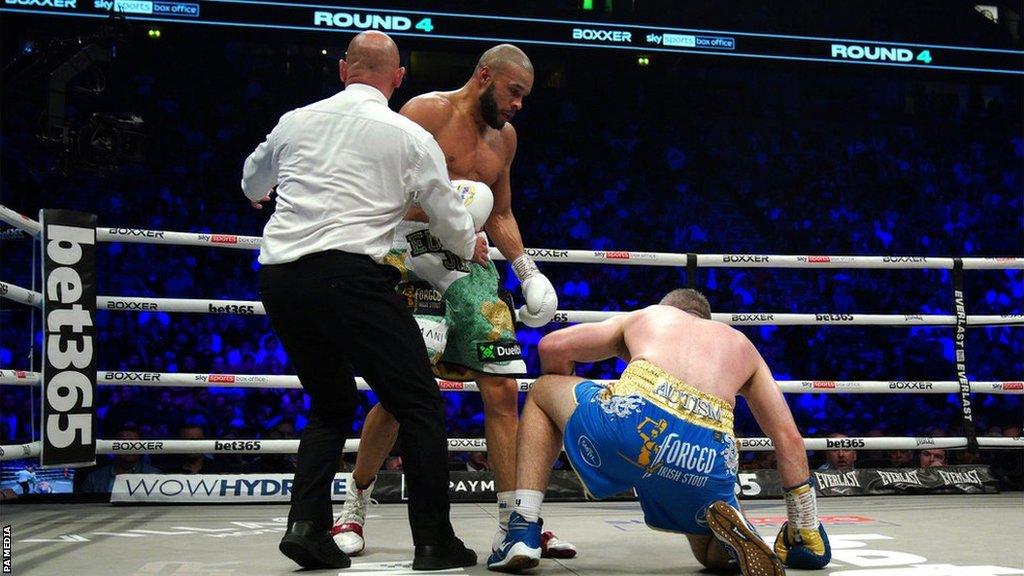 Chris Eubank Jr stands over Liam Smith