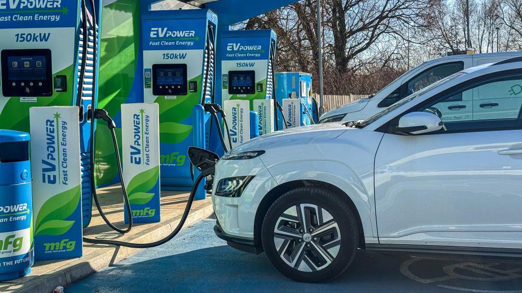 cars parked at charging stations being charged