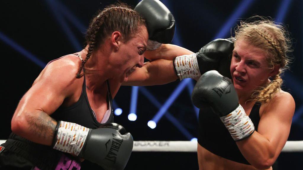 Ebonie Jones fighting in a boxing ring