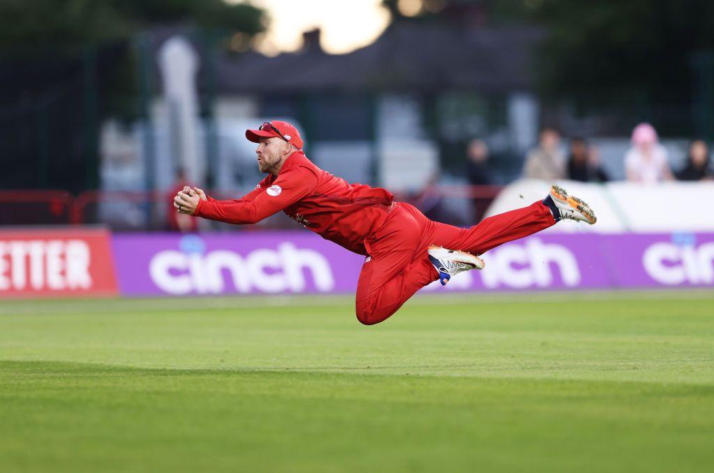 Steven Croft takes a diving catch for Lancashire