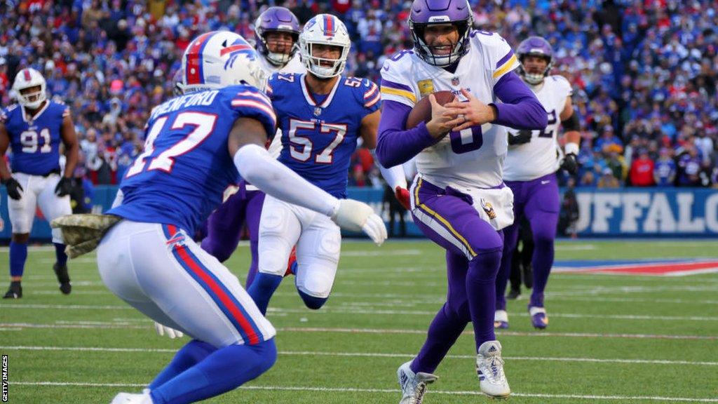 Kirk Cousins runs with the ball for Minnesota