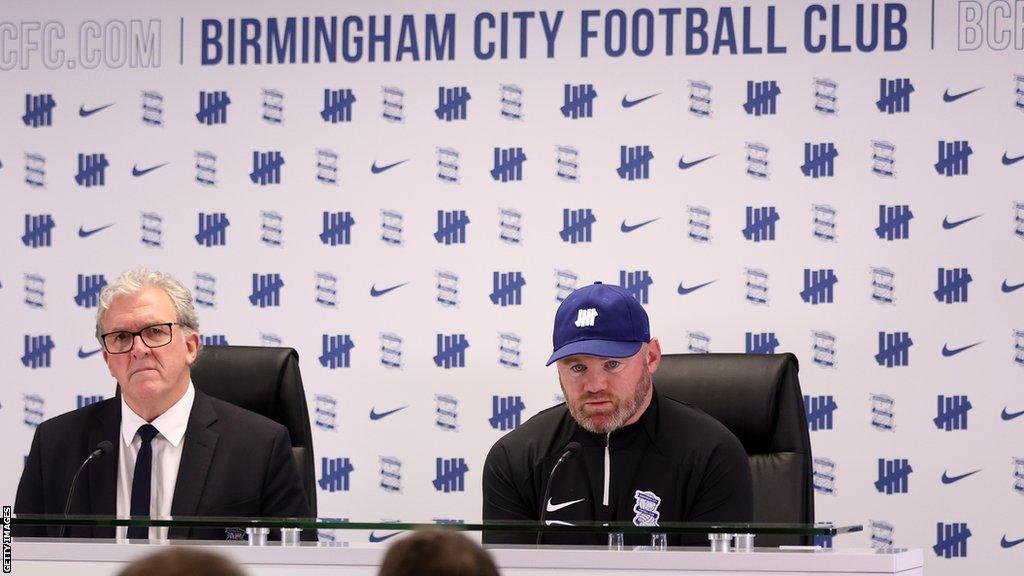 Birmingham City CEO Garry Cook (left) and new manager Wayne Rooney (right) meet the press