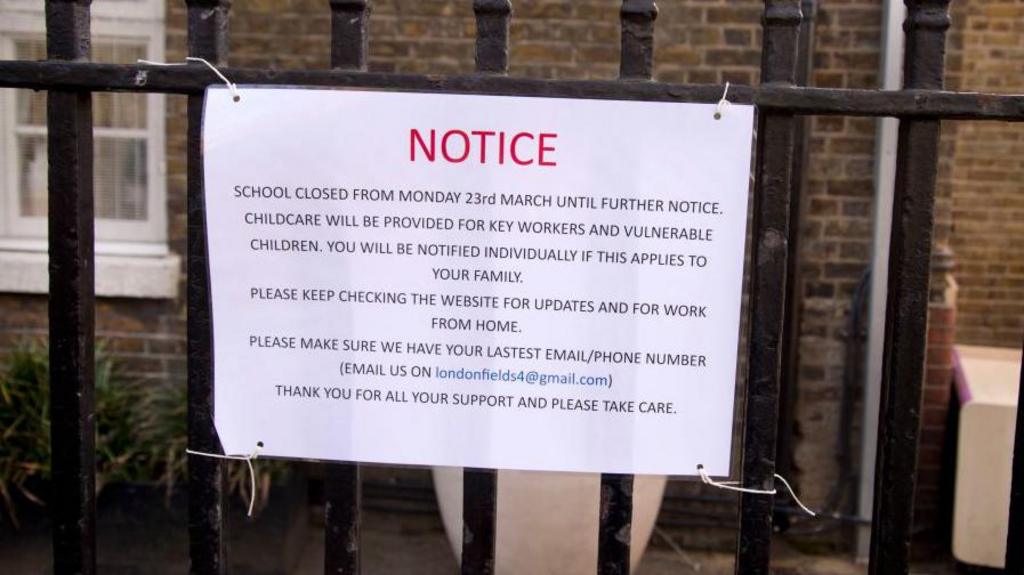 Picture on playground railings saying school closed 23 March