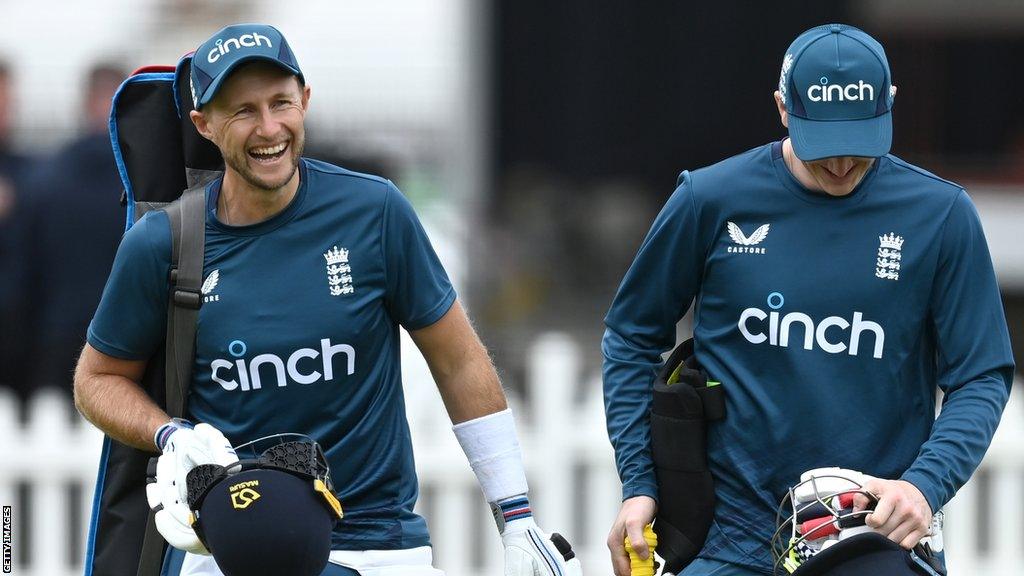 Joe Root shares a joke with Harry Brook