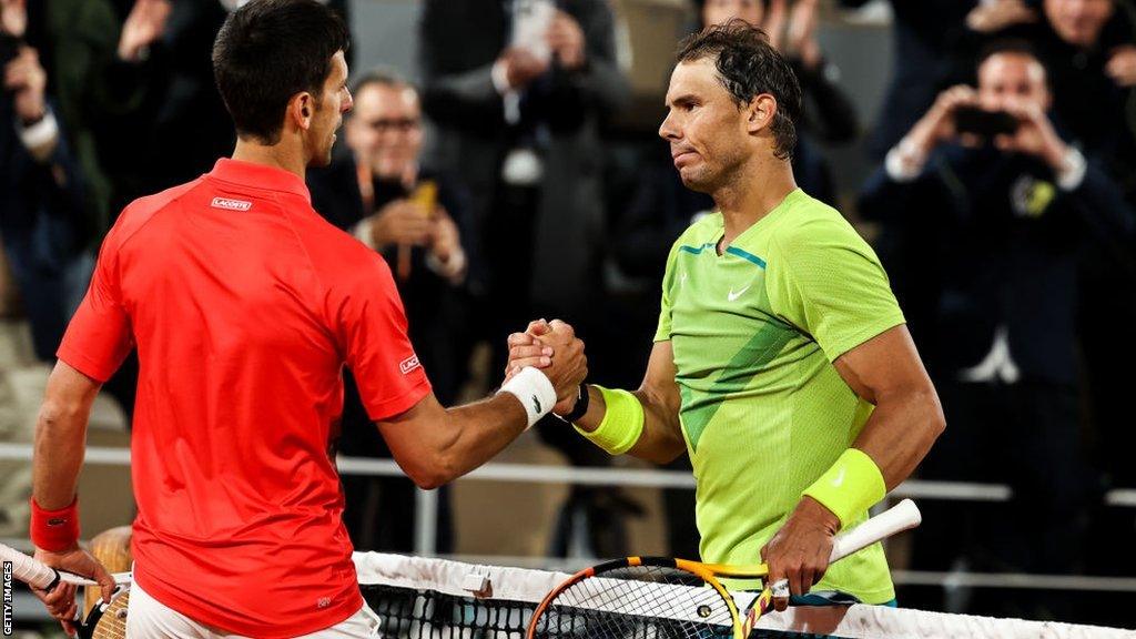 Rafael Nadal and Novak Djokovic shake hands at the net at last year's French Open