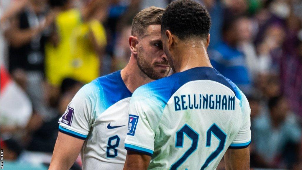 Jude Bellingham celebrates with Jordan Henderson at the Qatar World Cup