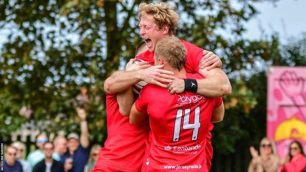 Jerseys Reds players celebrate together in happier times