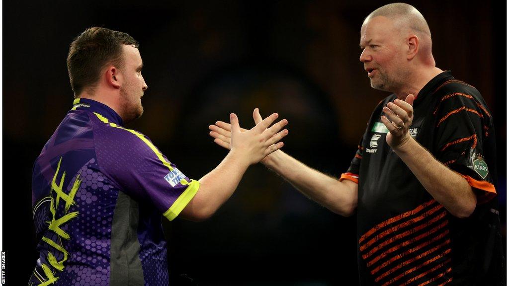 Luke Littler shaking hands with Raymond van Barneveld after his fourth-round win