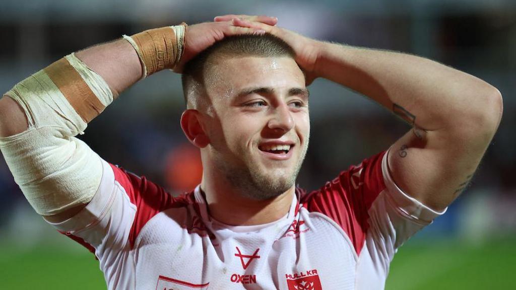 Hull KR's Mikey Lewis smiling with his hands on his head 