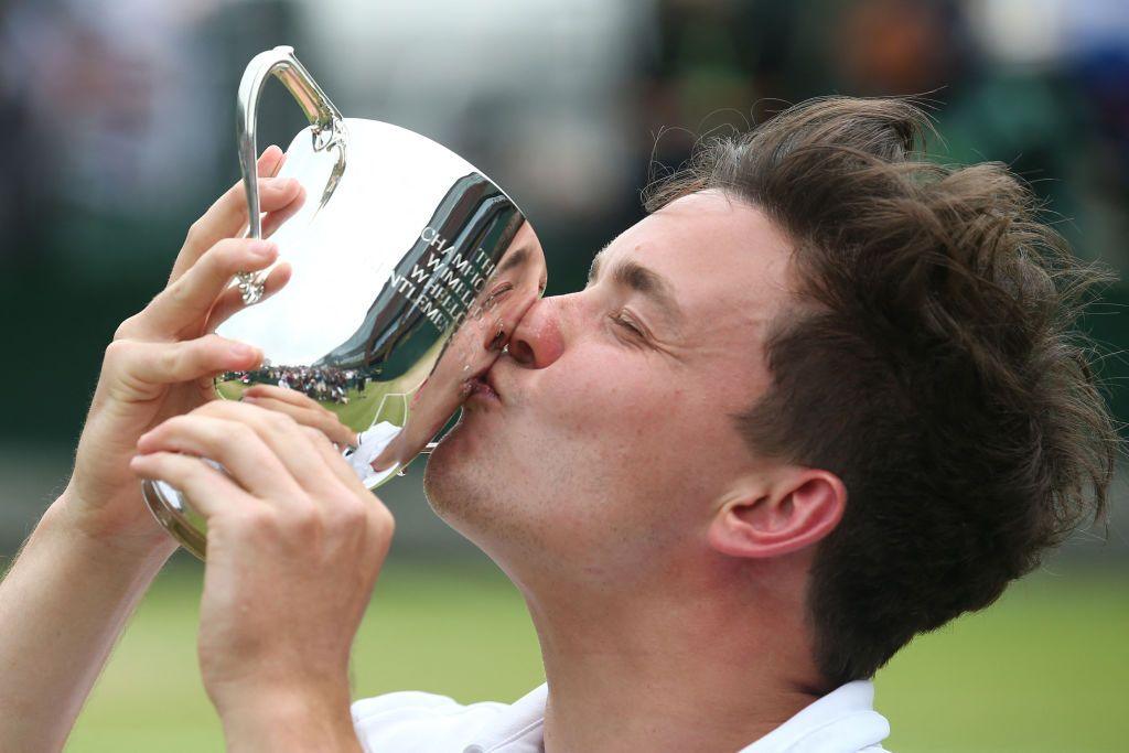 Gordon Reid kisses his Wimbledon singles trophy