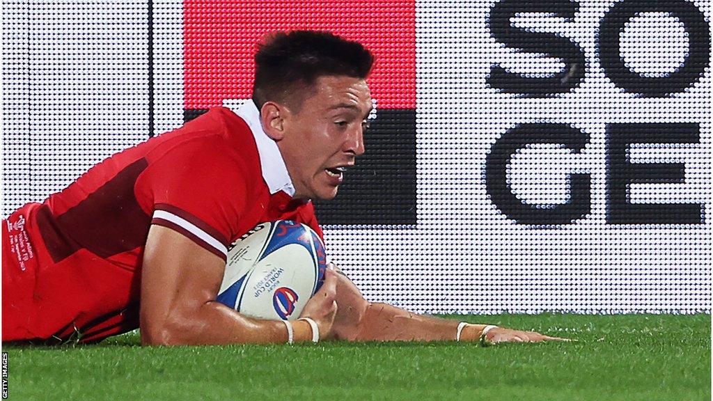 Wales wing Josh Adams scores a try