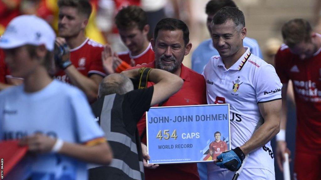 John-John Dohmen receives a presentation before England's match against Belgium for earning a record-breaking 454th international cap