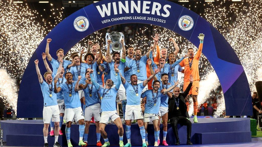 Manchester City players celebrate winning the Champions League