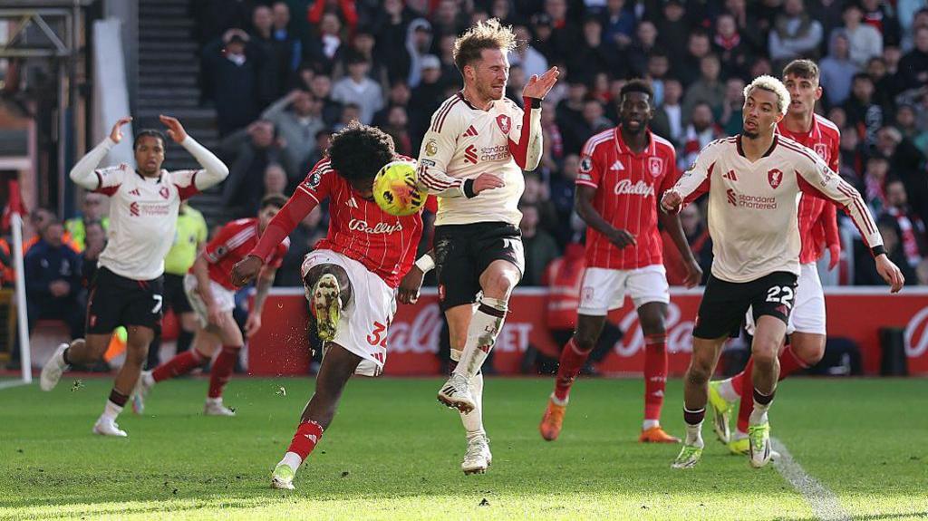Alexis Mac Allister scores a goal which is later disallowed for handball following a VAR review during the Premier League match between Nottingham Forest and Liverpool