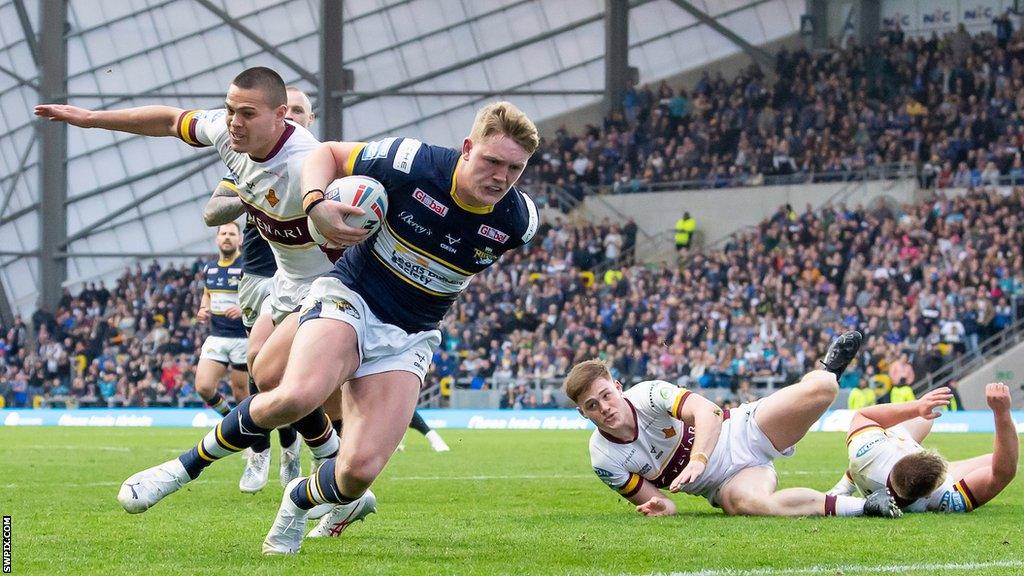 Leeds' James McDonnell heads in for a try against Huddersfield