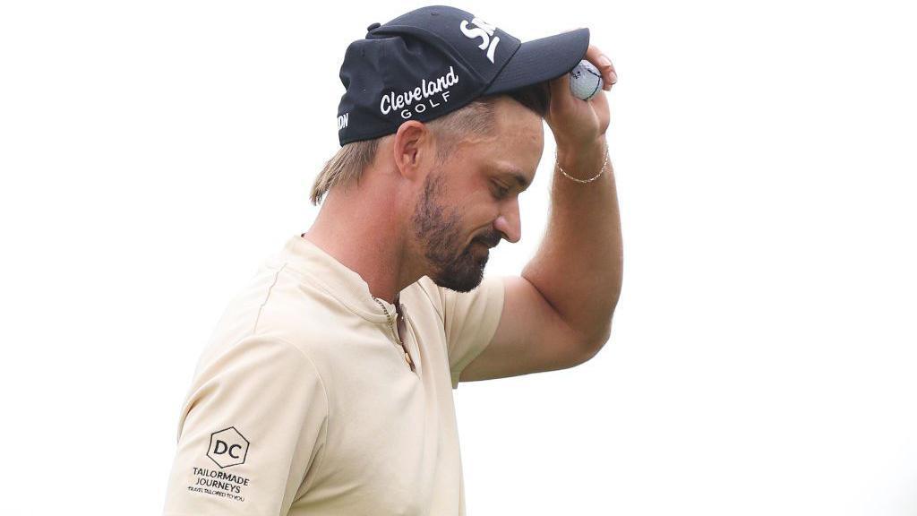 Brandon Robinson-Thompson of England acknowledges the crowd after putting at the Qatar Masters